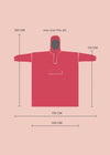 Red poncho with size chart on a pink background