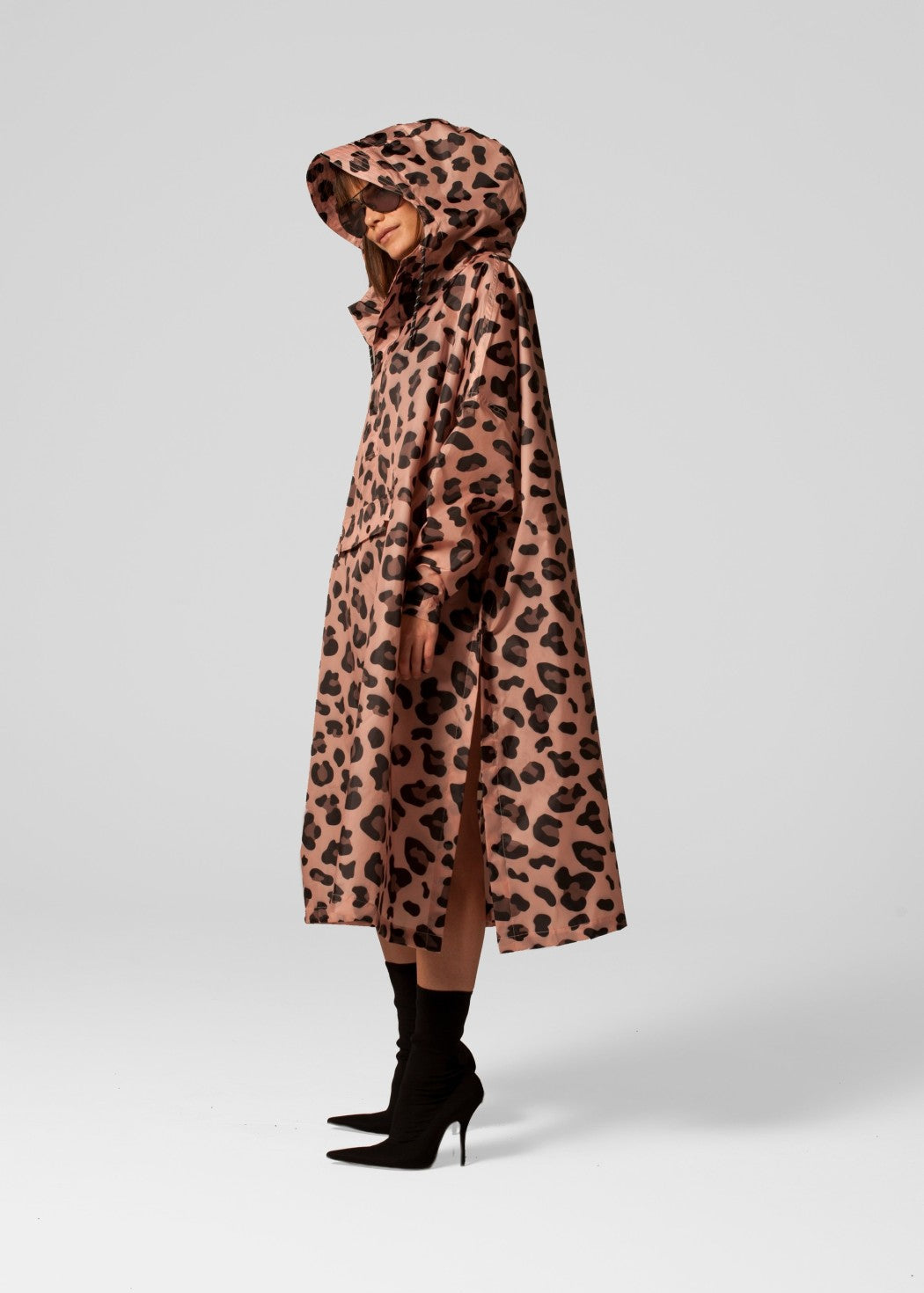 Leopard print hooded coat worn by a person on a white background