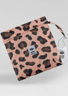 Leopard print pouch with brand label on a light gray background
